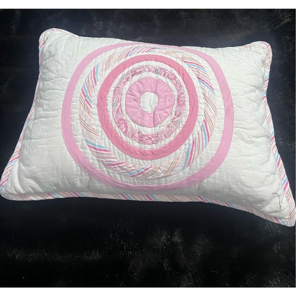 Land of Nod circle pinks throw pillow